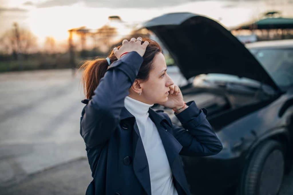 Can I Fix My Own Car with Insurance Money - Women having car trouble