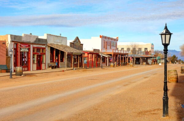 Considered negligence in Arizona - A view of a deserted, old western-style street lined with wooden buildings and a vintage streetlamp in Arizona