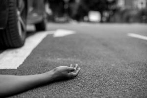 pedestrian lay on the floor after being part of an accident for a negligent driver.