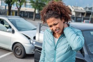 woman experiences whiplash and neck injuries after a car accident