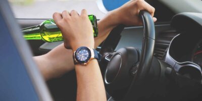 A Person Drinking While Driving. Not Recommended By DUI Accident Lawyers In Arizona