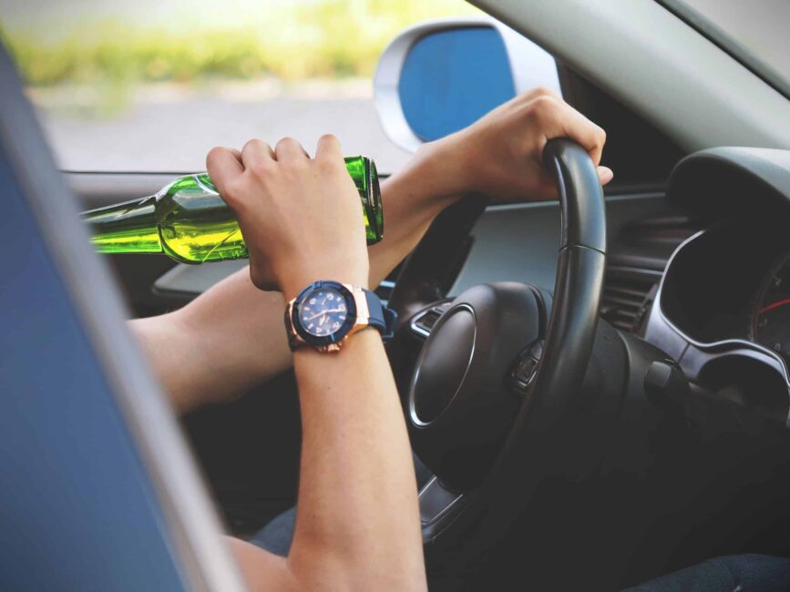 A person drinking while driving. Not recommended by DUI Accident Lawyers in Arizona