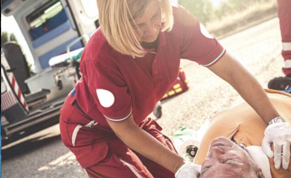 A paramedic attending to patient of arizona vehicular accidents 2014