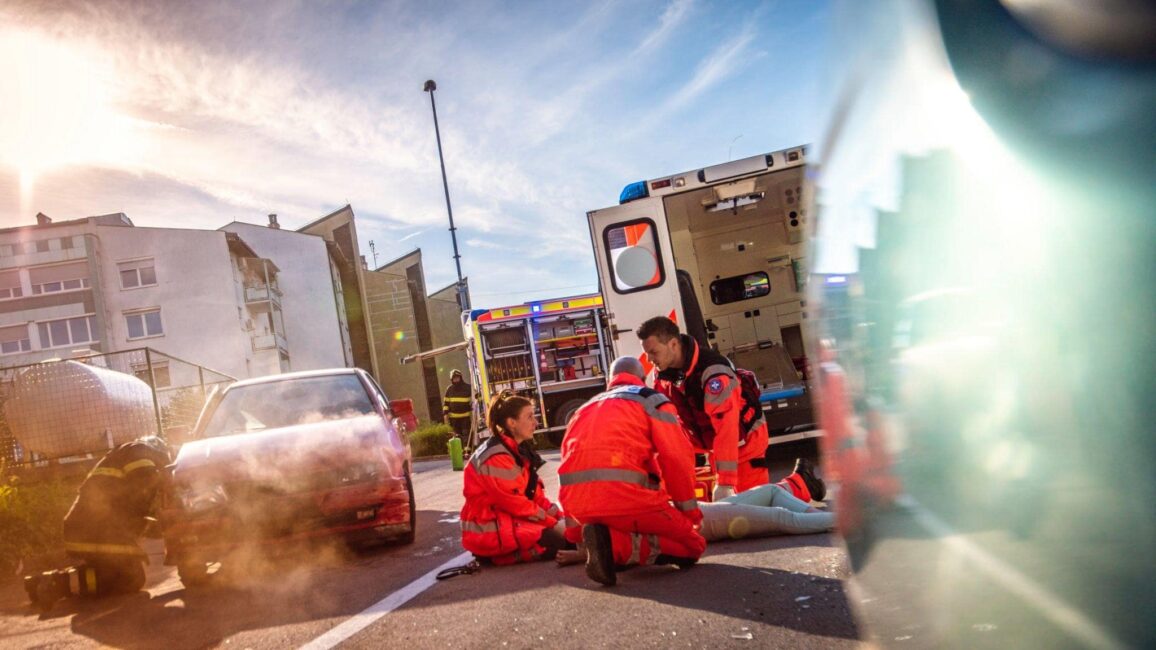 rescuers saving a victim from a high-speed hit and run crash