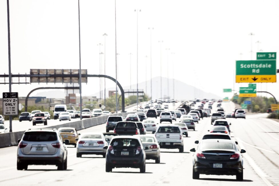 Car Insurance Adjuster: How to Scare an Insurance Adjuster: A bustling freeway filled with numerous cars driving, showcasing the chaos and activity of traffic in Arizona