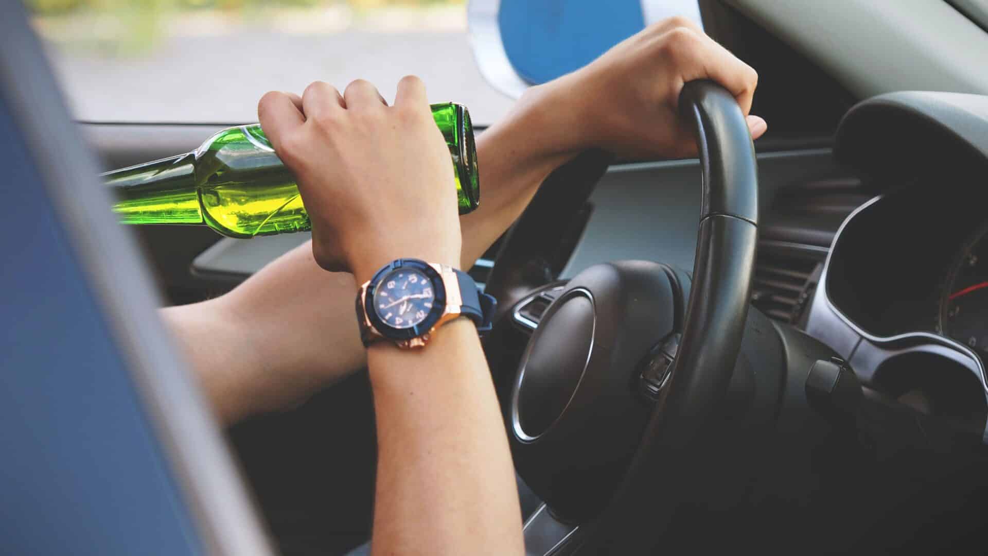 A person drinking while driving. Not recommended by DUI Accident Lawyers in Arizona